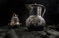 Chinese antique teapot Characters chinese is Double Happiness in frot of Silver antique incense burner on dark background Royalty Free Stock Photo