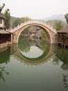 Chinese arch bridge with decorations reflected Royalty Free Stock Photo