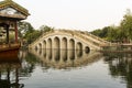 Asian arch bridge in chinese garden Royalty Free Stock Photo