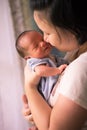 Chinese Asian Malaysian mother and her newborn infant baby boy Royalty Free Stock Photo