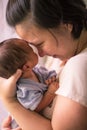 Chinese Asian Malaysian mother and her newborn infant baby boy Royalty Free Stock Photo