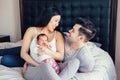 Chinese Asian mother and Caucasian father with mixed race newborn infant baby son daughter. Royalty Free Stock Photo