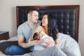 Chinese Asian mother and Caucasian father with mixed race newborn infant baby son daughter. Royalty Free Stock Photo