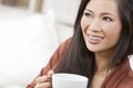 Chinese Asian Woman Drinking Tea or Coffee Royalty Free Stock Photo