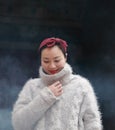 Chinese Asian Woman Wearing a sweater and a Scarft Royalty Free Stock Photo