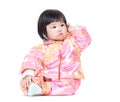 Chinese baby girl scratching hair Royalty Free Stock Photo