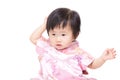 Chinese baby girl touch her hair Royalty Free Stock Photo