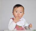 A Chinese baby sucking fingers