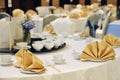 Chinese banquet party decor white table with gold napkin Royalty Free Stock Photo