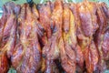 Chinese barbecue pork char siu fresh from oven to hanging display Royalty Free Stock Photo