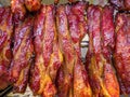 Chinese barbecue pork char siu fresh from oven to hanging display Royalty Free Stock Photo