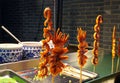 Chinese barbecue squid on stick at the market