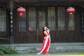 Chinese beauty is dancing in red dress Royalty Free Stock Photo