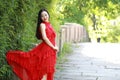 Chinese beauty sit on an ancient bridge enjoy vacation Royalty Free Stock Photo