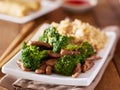 Chinese beef and broccoli stir fry with fried rice Royalty Free Stock Photo