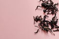 Chinese black tea on pink background. Dianhong. Copy space