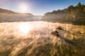 Chinese boats on foggy lake Royalty Free Stock Photo