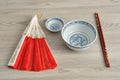 Chinese bowls, chopsticks and a hand fan Royalty Free Stock Photo