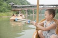 Chinese boy playing water gun Royalty Free Stock Photo