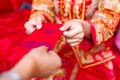 Chinese bride giving red pocket lucky money
