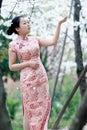 Chinese bride in traditional dress outdoor Royalty Free Stock Photo