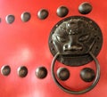 Chinese bronz lion knob on red gate doors Royalty Free Stock Photo