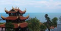 Chinese buddhist pagoda on front of sea.