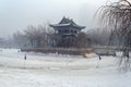 Chinese building on frozen lake in Urumqi