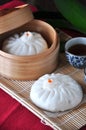 Chinese Bun with Tea on Background Royalty Free Stock Photo