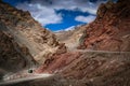 Chinese bus on road to mountain pass Royalty Free Stock Photo