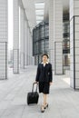 Chinese business women with suitcase