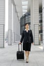 Chinese business women with suitcase Royalty Free Stock Photo