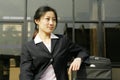 Chinese business women with suitcase Royalty Free Stock Photo