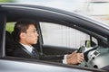 Chinese businessman driving car