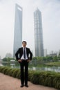 Chinese businessman near skyscrapers Royalty Free Stock Photo