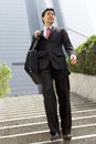 Chinese Businessman Walking Down Steps Royalty Free Stock Photo