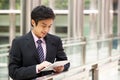 Chinese Businessman Working On Tablet Computer