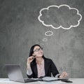 Chinese businesswoman looking at a cloud tag Royalty Free Stock Photo