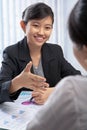 Chinese businesswoman offering handshake