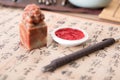 Chinese calligraphy and a seal and ink pad and a carving knife Royalty Free Stock Photo