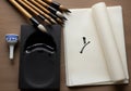 Chinese calligraphy set includes bamboo brushes with black Royalty Free Stock Photo