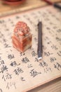 Chinese calligraphy work with seal and carving knife Royalty Free Stock Photo