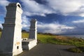 Chinese Cemetery Monument Portal and Green Grass Landscape with Stormy Sky Cloudscape Royalty Free Stock Photo