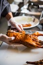 Chinese chef cooking peking roasted duck at the kitchen of restaurant Royalty Free Stock Photo