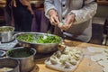 Chinese chef making dumplings in the kitchen Royalty Free Stock Photo