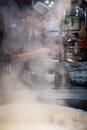 Chinese chef preparing hot food Royalty Free Stock Photo