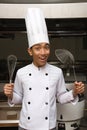 Chinese chef showing utensils