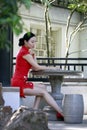 Chinese cheongsam model in Chinese classical garden