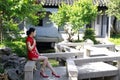 Chinese cheongsam model in Chinese classical garden Royalty Free Stock Photo