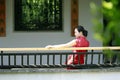 Chinese cheongsam model in Chinese classical garden